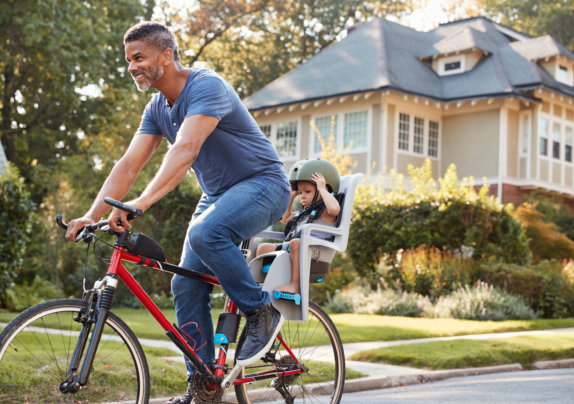 parenting and divorce during a crisis - father cycling outside with his child