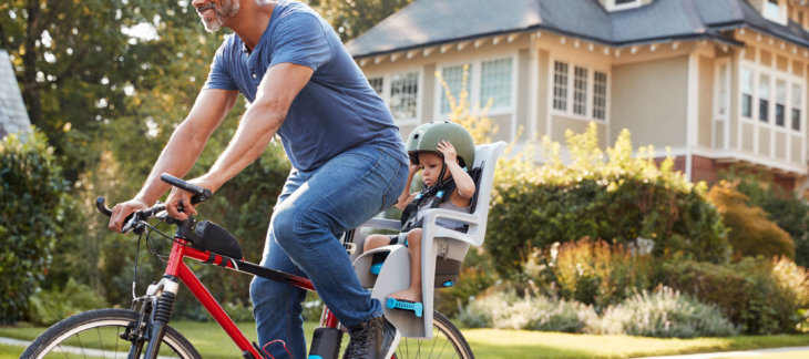 parenting and divorce during a crisis - father cycling outside with his child