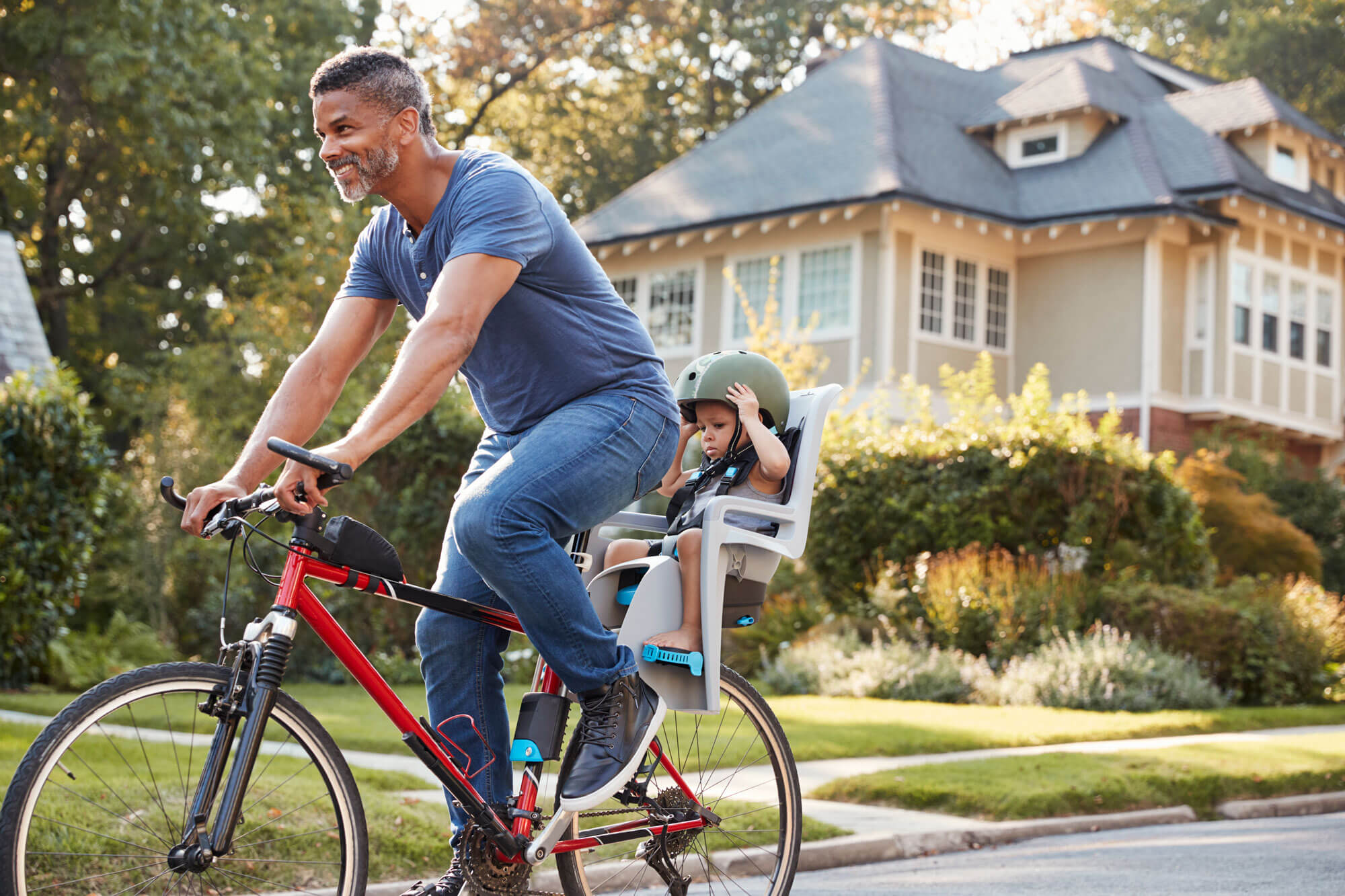 parenting and divorce during a crisis - father cycling outside with his child