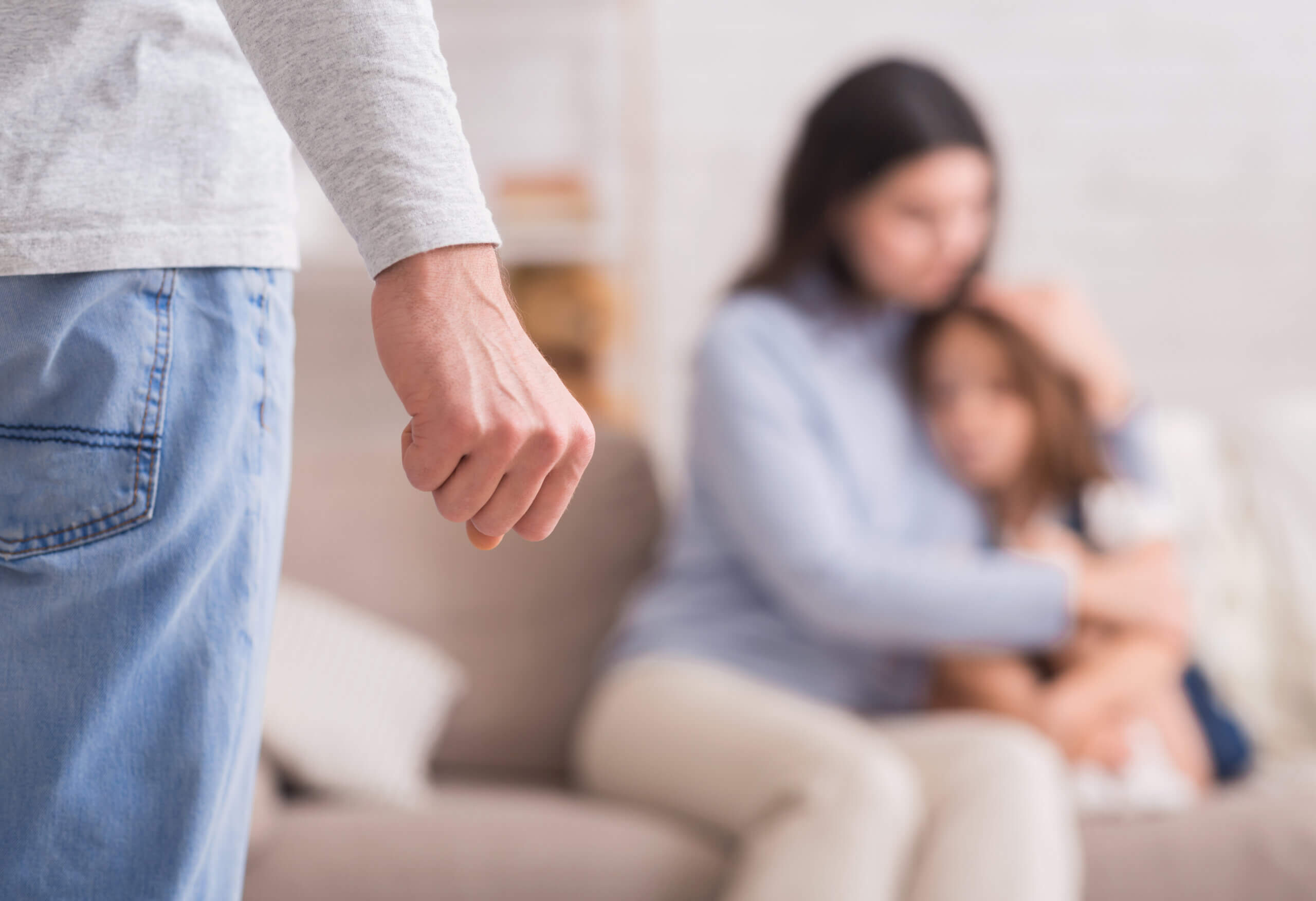 Domestic abuse. Scared woman and little girl suffering from father's violence Domestic abuse. Scared woman and little girl suffering from father's violence